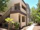 Exterior view featuring stairs, balconies, landscaped greenery, and walkways at 5250 S Rainbow Blvd # 1010, Las Vegas, NV 89118