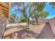 Expansive backyard featuring a concrete patio and low-maintenance desert landscaping at 5257 Sunbury Ave, Las Vegas, NV 89122