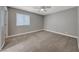 Spacious bedroom featuring neutral paint, carpet, a large window and ample natural light at 5257 Sunbury Ave, Las Vegas, NV 89122