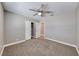 Neutral bedroom featuring a ceiling fan, closet with double doors, and baseboards at 5257 Sunbury Ave, Las Vegas, NV 89122