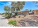Single-story home featuring desert landscaping, a driveway, and an attached garage at 5257 Sunbury Ave, Las Vegas, NV 89122