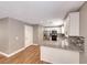 Spacious kitchen featuring granite countertops, stainless steel appliances and eat-in dining area at 5257 Sunbury Ave, Las Vegas, NV 89122