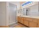 Bright bathroom with double sinks, spacious shower, and stylish light fixtures at 5317 Marietta Ave, Las Vegas, NV 89108