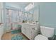 Bright bathroom with a double vanity, tile floors, and a tub/shower combination at 5317 Marietta Ave, Las Vegas, NV 89108