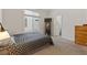Cozy bedroom with a window, carpet flooring, neutral walls, and a wardrobe at 5317 Marietta Ave, Las Vegas, NV 89108
