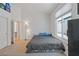 Bright bedroom featuring carpet, closet space, a window, and neutral-toned walls at 5317 Marietta Ave, Las Vegas, NV 89108