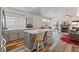 Open kitchen and living area with an island, fireplace, and modern flooring at 5317 Marietta Ave, Las Vegas, NV 89108
