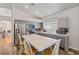 Modern kitchen with stainless steel appliances, tile backsplash, and center island seating at 5317 Marietta Ave, Las Vegas, NV 89108