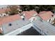 Aerial shot showcasing the house with a backyard entrance, attached garage and the neighborhood at 5400 Paul Kurtz Way # 105, Las Vegas, NV 89108