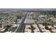 Picturesque aerial view showcasing the community's well-planned layout and street access at 5400 Paul Kurtz Way # 105, Las Vegas, NV 89108
