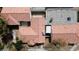 Aerial view showcasing the house's red tile roof, backyard patio, and surrounding neighborhood at 5400 Paul Kurtz Way # 105, Las Vegas, NV 89108