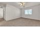 A carpeted bedroom with white walls and a window bringing in natural light at 5400 Paul Kurtz Way # 105, Las Vegas, NV 89108