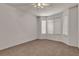 Carpeted bedroom with natural light coming in from the large window at 5400 Paul Kurtz Way # 105, Las Vegas, NV 89108