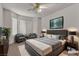 Nicely staged bedroom featuring carpeted floors, bay windows, and stylish decor at 5400 Paul Kurtz Way # 105, Las Vegas, NV 89108