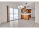 Dining area featuring sliding doors, light-colored tile, and connected to kitchen at 5400 Paul Kurtz Way # 105, Las Vegas, NV 89108
