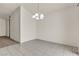 View from the dining area showcases neutral paint, chandelier, and access to additional rooms at 5400 Paul Kurtz Way # 105, Las Vegas, NV 89108