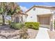 Charming single-story home featuring a stucco exterior and meticulously maintained landscaping at 5400 Paul Kurtz Way # 105, Las Vegas, NV 89108