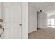 Warm and inviting foyer featuring neutral carpeting and views into the living area at 5400 Paul Kurtz Way # 105, Las Vegas, NV 89108
