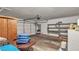 View of the spacious garage with an automatic door, shelving and room for storage at 5400 Paul Kurtz Way # 105, Las Vegas, NV 89108