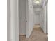 Hallway featuring neutral carpet leading to doorways, freshly painted white walls at 5400 Paul Kurtz Way # 105, Las Vegas, NV 89108