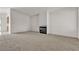 Spacious living room with fireplace and neutral carpeting at 5400 Paul Kurtz Way # 105, Las Vegas, NV 89108