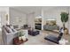 Stylish staged living room with modern furniture, fireplace, and contemporary decor at 5400 Paul Kurtz Way # 105, Las Vegas, NV 89108
