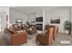 Staged living room showcasing a fireplace and ample seating for relaxation at 5400 Paul Kurtz Way # 105, Las Vegas, NV 89108