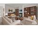 Staged living room with fireplace and built-in shelving creating a cozy atmosphere at 5400 Paul Kurtz Way # 105, Las Vegas, NV 89108