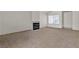 Spacious living room with fireplace and neutral carpeting providing a blank canvas at 5400 Paul Kurtz Way # 105, Las Vegas, NV 89108