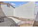 Exterior view of the patio with a fence and gravel at 5400 Paul Kurtz Way # 105, Las Vegas, NV 89108