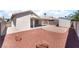 Spacious backyard with gravel landscaping, a storage shed, and covered patio area at 5524 La Pelusa St, North Las Vegas, NV 89031