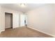 Bright bedroom featuring neutral walls, plush carpet, and a closet for ample storage at 5524 La Pelusa St, North Las Vegas, NV 89031