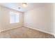 Inviting bedroom with cozy carpet, a bright window and neutral walls to enhance the natural light at 5524 La Pelusa St, North Las Vegas, NV 89031
