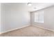 Bright bedroom with neutral walls, a large window, and cozy carpet flooring at 5524 La Pelusa St, North Las Vegas, NV 89031