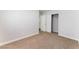 Comfortable bedroom with neutral walls and carpet, plus a closet for organized storage at 5524 La Pelusa St, North Las Vegas, NV 89031
