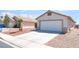 Charming single-story home with a two-car garage and desert landscaping at 5524 La Pelusa St, North Las Vegas, NV 89031