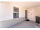 Covered front porch with desert landscaping, window and entry way at 5524 La Pelusa St, North Las Vegas, NV 89031