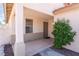 Covered front porch with desert landscaping features a cozy entryway at 5524 La Pelusa St, North Las Vegas, NV 89031