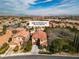 Picturesque aerial view of the property nestled in a vibrant community against a mountain backdrop at 556 Caribbean Palm Dr, Las Vegas, NV 89138