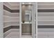 Stylish half-bath with modern sink and striped walls at 556 Caribbean Palm Dr, Las Vegas, NV 89138