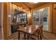 Covered outdoor dining area with sliding glass doors leading to the living room and kitchen at 556 Caribbean Palm Dr, Las Vegas, NV 89138