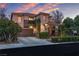 Charming two-story home with a well-manicured front yard and a two car garage at 556 Caribbean Palm Dr, Las Vegas, NV 89138
