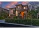 Charming two-story home with a well-manicured front yard and great curb appeal at 556 Caribbean Palm Dr, Las Vegas, NV 89138