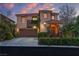 Charming two-story home with a well-manicured front yard and a two car garage at 556 Caribbean Palm Dr, Las Vegas, NV 89138