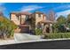 Beautiful two-story home with well-maintained landscaping and a two-car garage enhancing curb appeal at 556 Caribbean Palm Dr, Las Vegas, NV 89138