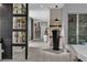 Modern hallway showcasing plant displays, neutral decor, and tiled floors, providing an inviting path at 556 Caribbean Palm Dr, Las Vegas, NV 89138