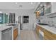 Contemporary kitchen with stainless steel appliances, sleek cabinetry, and an island with a sink at 556 Caribbean Palm Dr, Las Vegas, NV 89138