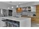 Modern kitchen with a large island, bar seating, stainless steel appliances, and sleek cabinetry at 556 Caribbean Palm Dr, Las Vegas, NV 89138