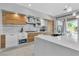 Well-lit kitchen with a large island, modern appliances, and elegant cabinetry, perfect for cooking at 556 Caribbean Palm Dr, Las Vegas, NV 89138