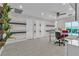 Bright living area with white tile flooring, and a glass dining table and chair set at 556 Caribbean Palm Dr, Las Vegas, NV 89138